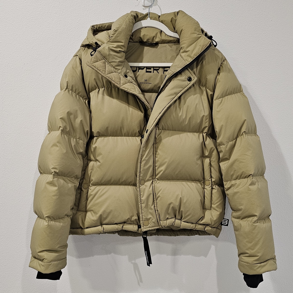 Aritzia's The Super Puff Shorty Jacket in Khaki Green with Detachable Hood